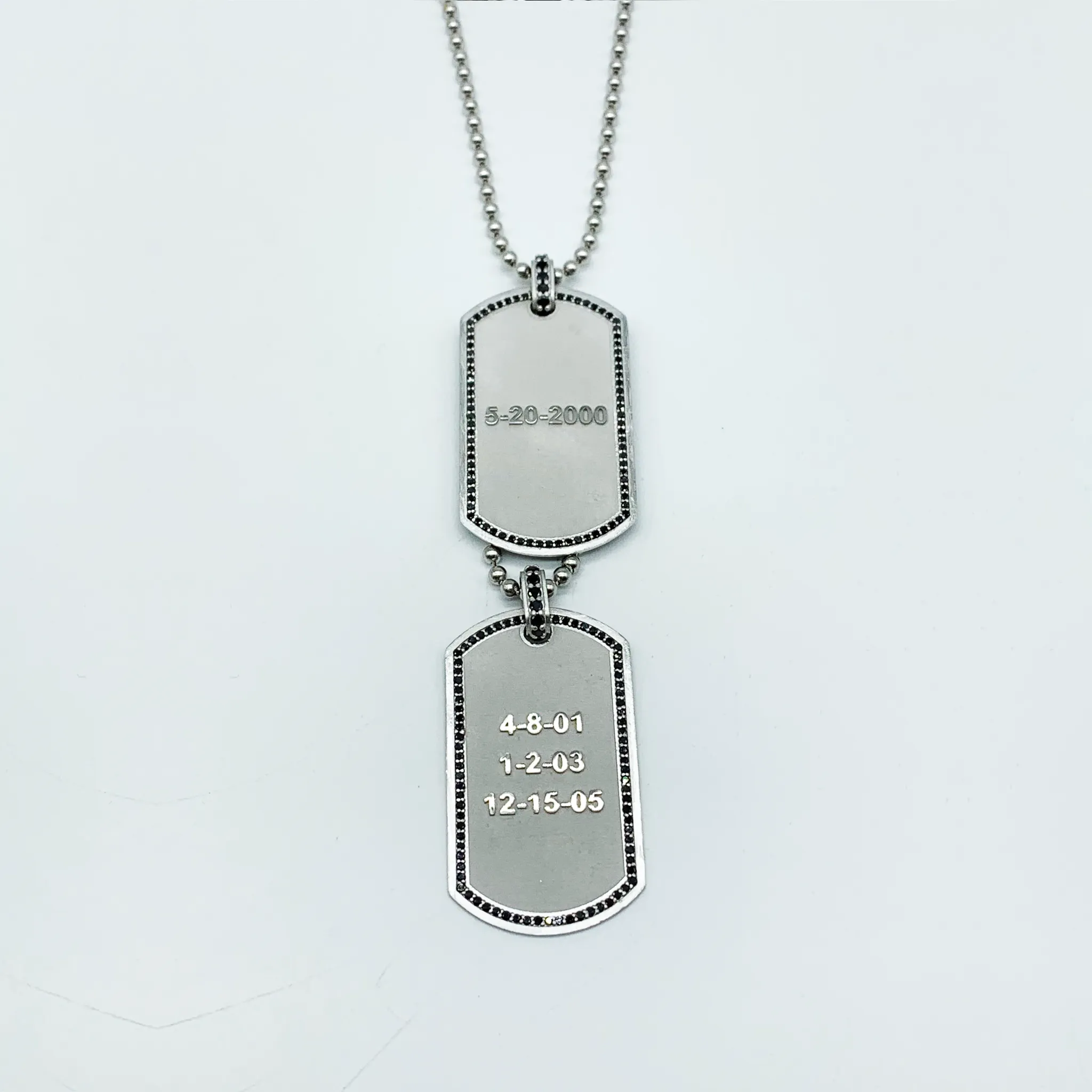 CA Custom “We are family” 18 karat white gold and black diamond dual tags.