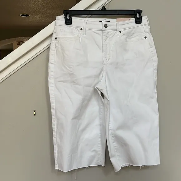 NYDJ Kristie '80s Bermuda Denim ShortsWith Raw Hems In Optic White.
