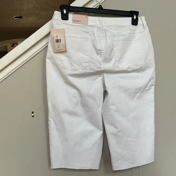 NYDJ Kristie '80s Bermuda Denim ShortsWith Raw Hems In Optic White.