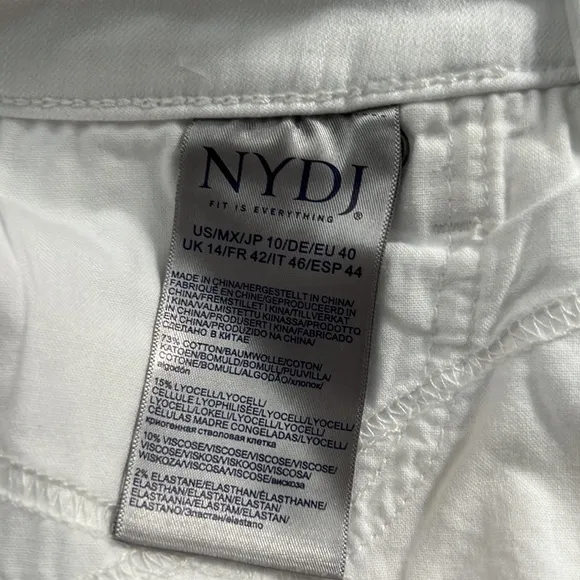 NYDJ Kristie '80s Bermuda Denim ShortsWith Raw Hems In Optic White.